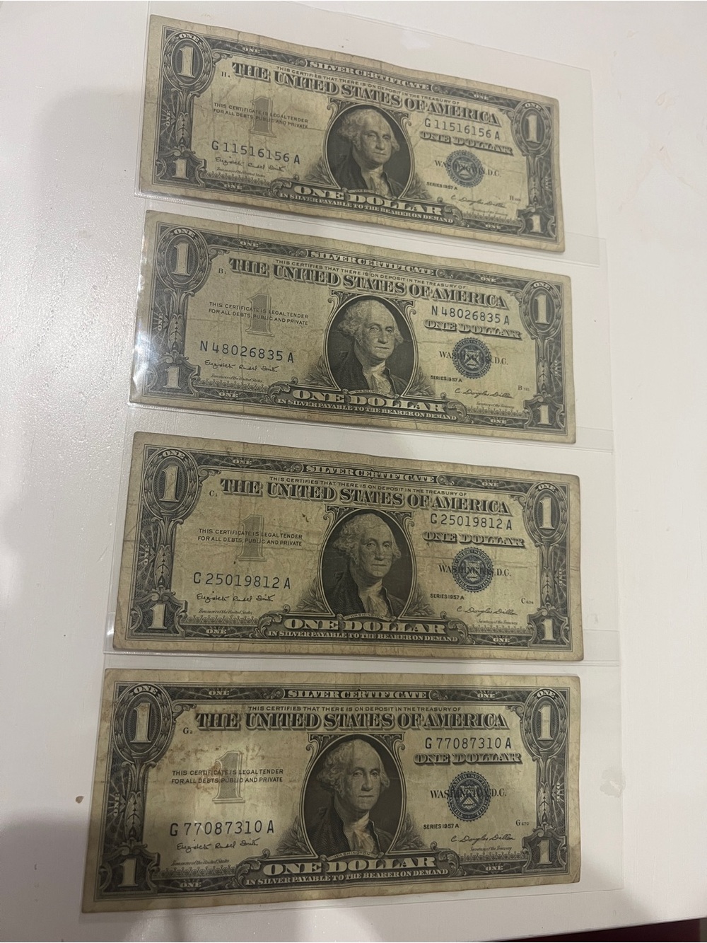 1957 A One Dollar Silver Certificate bill (lot of 4)